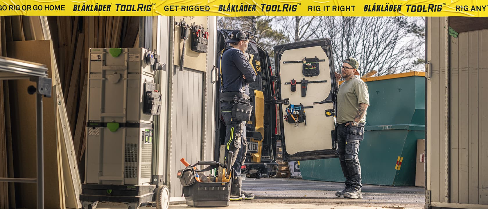 Workers organizing tools inside a service van equipped with the Blåkläder ToolRig system, showcasing a modular and durable mobile storage solution for professional trades.